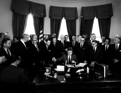 President John F. Kennedy Signs Communications Satellite Act of 1962 - AR7444-E photo