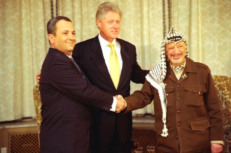 President Bill Clinton with Prime Minister Ehud Barak of Israel and Chairman Yasser Arafat of the Palestinian Authority photo