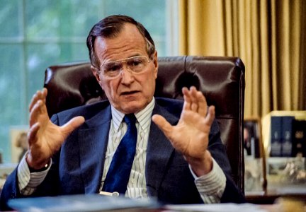 President George H. W. Bush at his Oval Office desk
