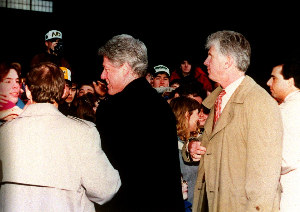 President Bill Clinton is greeted by onlookers