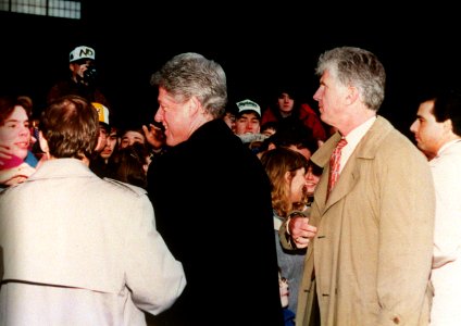 President Bill Clinton is greeted by onlookers photo