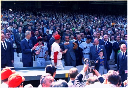 President Nixon throwing out the first ball on opening day of the 1969 baseball season between the Washington... - NARA - 194284