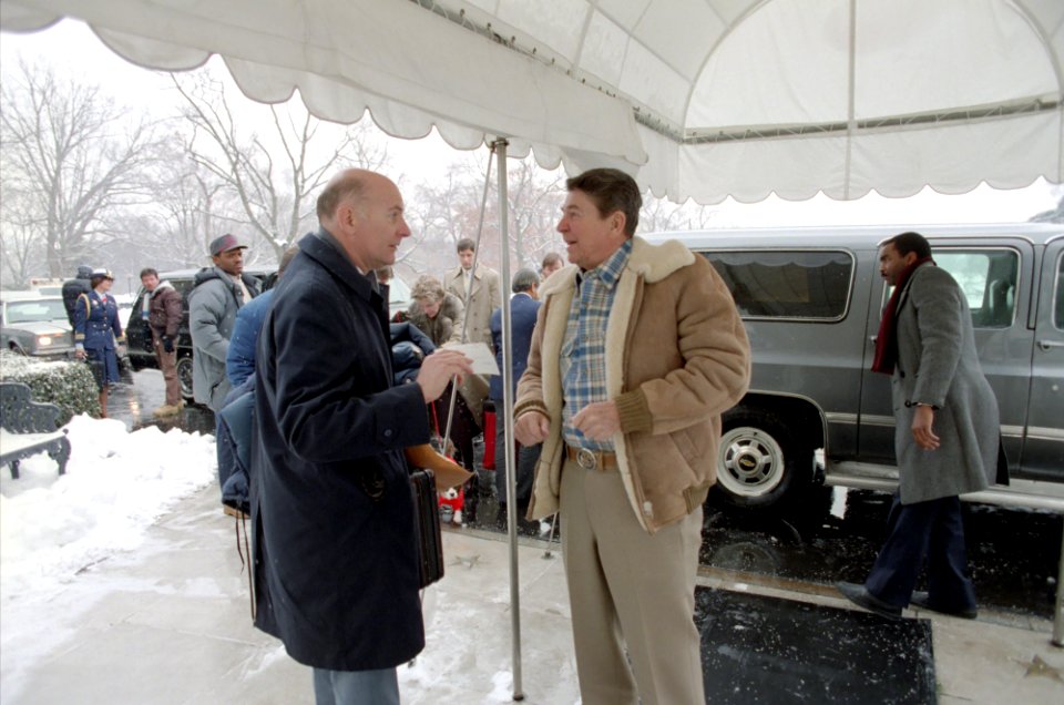 President Ronald Reagan arrival in snow via Chevy Suburban at the White House