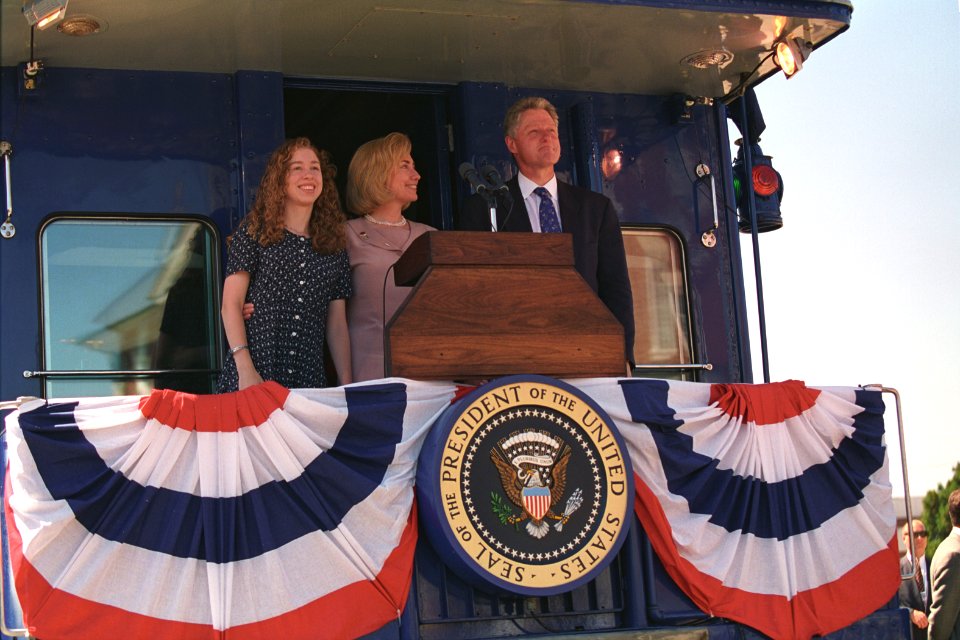 President Bill Clinton, Hillary Clinton, and Chelsea Clinton Waving from a Train