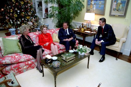 President Ronald Reagan during a dinner with Billy Graham and Mrs. Graham in the Residence