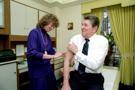 President Ronald Reagan getting a shot in White House Doctors office photo