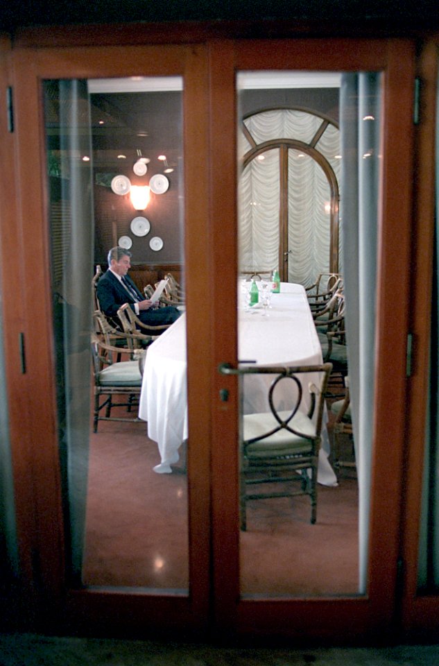 President Ronald Reagan during his trip to Venice, Italy and working alone at the Hotel Cipriani