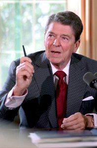 President Ronald Reagan during a meeting for a briefing on the upcoming statement about South Africa in the Oval Office