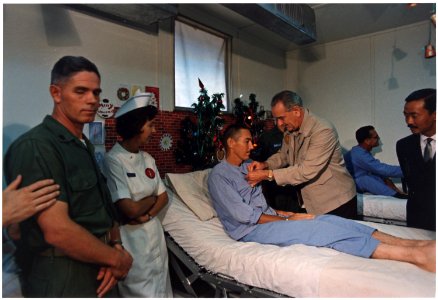 President Lyndon B. Johnson in Vietnam, Decorating a soldier in a hospital - NARA - 192518