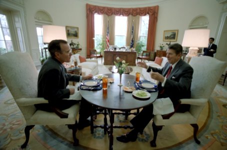 President Ronald Reagan eating lunch with George H. W. Bush in the Oval Office