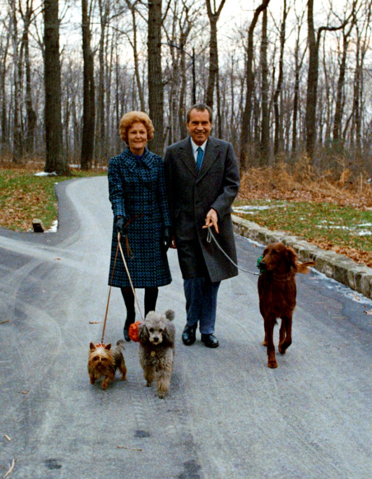 President Richard Nixon and Pat Nixon walking their dogs at Camp David