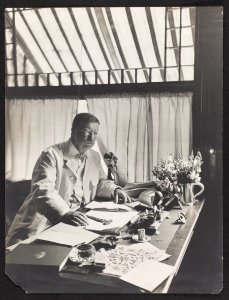 Pres. Theodore Roosevelt, half-length portrait, seated at desk, facing right LCCN93504158 photo