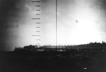 Refinery on Fais island seen through the periscope of USS Wahoo (SS-238) on 27 January 1943 photo