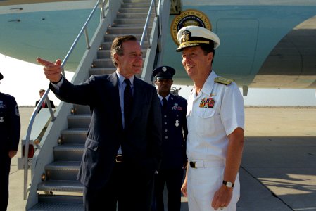 President George H. W. Bush is greeted by US Navy Rear Admiral Paul W. Parcells at NAS Miramar