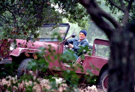 President Ronald Reagan driving his jeep at Rancho Del Cielo photo