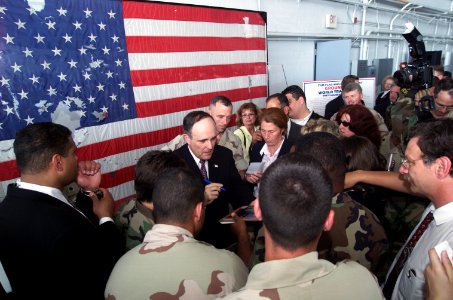 Rudy Giuliani signs autographs
