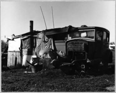 Sacramento, California. Close-up of one of 125 living units in squatter camps.... The dismantled aut . . . - NARA - 521732 photo