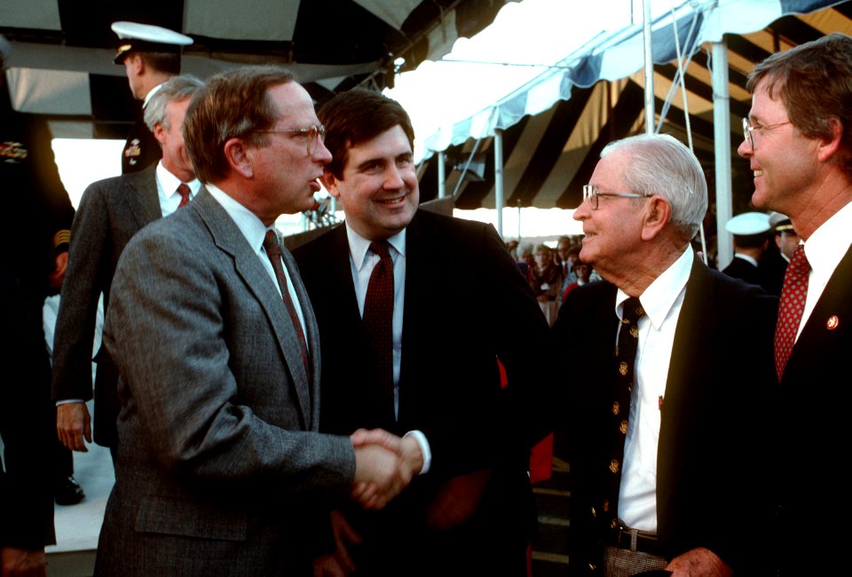 Sam Nunn and William Ball greet two members of the crowd on hand for the arrival of the nuclear-powered strategic missile submarine USS TENNESSEE (SSBN 734)