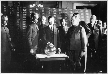 Second Draft. The first number drawn was 246, and was picked from the urn by Secretary of War Baker. Photo shows Secreta - NARA - 533713