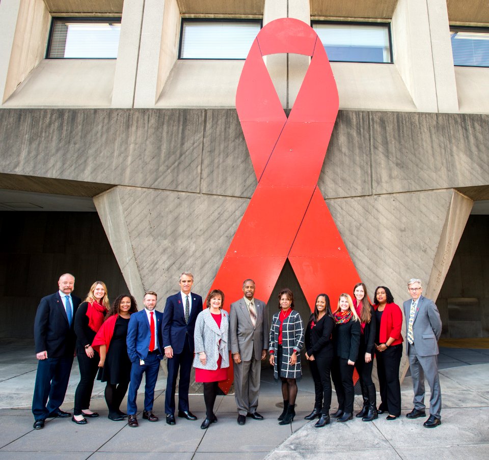 Secretary Carson and HOPWA with Word Aids Day Ribbon (24892209218)