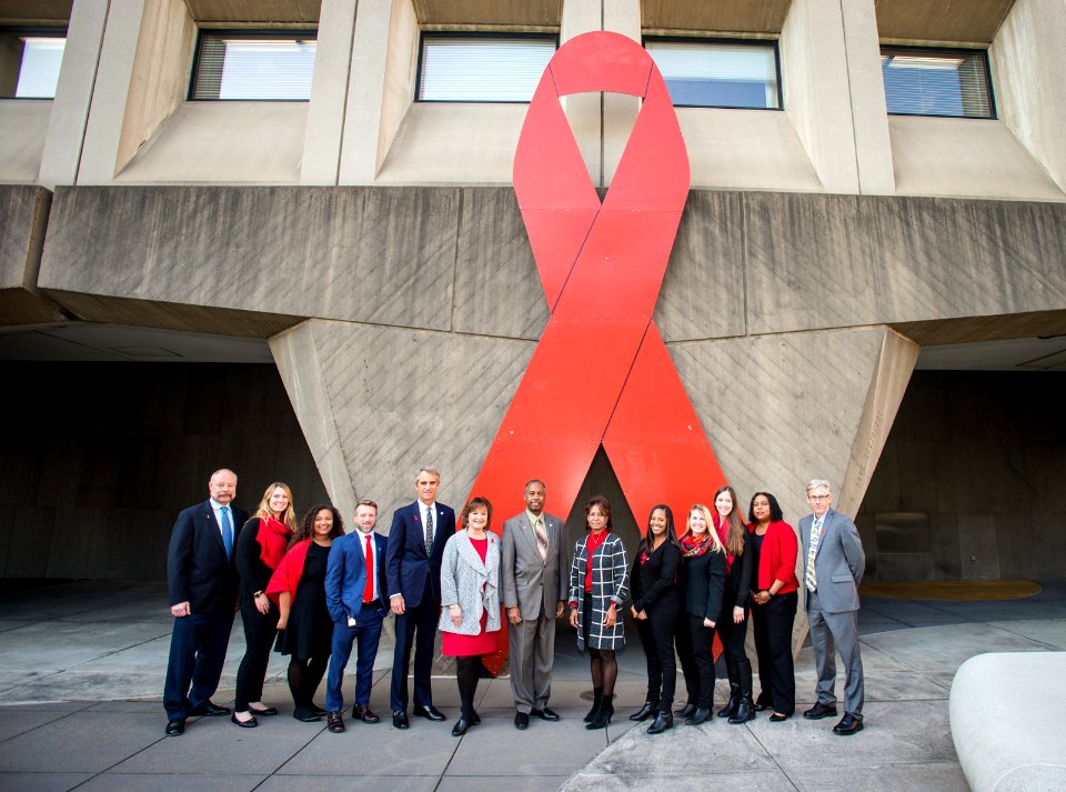 Secretary Carson and HOPWA with Word Aids Day Ribbon (24892209118)