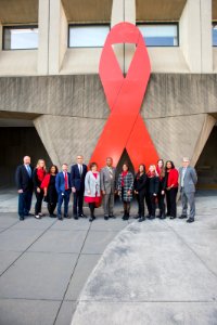 Secretary Carson and HOPWA with Word Aids Day Ribbon (24892208838)