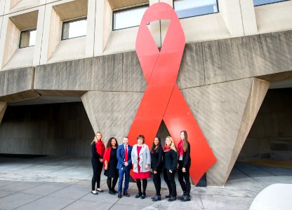 Secretary Carson and HOPWA with Word Aids Day Ribbon (24892209408)