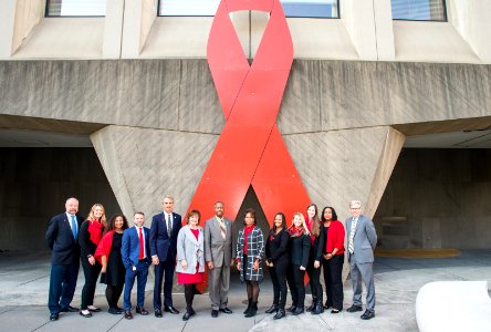 Secretary Carson and HOPWA with Word Aids Day Ribbon (24892209338)