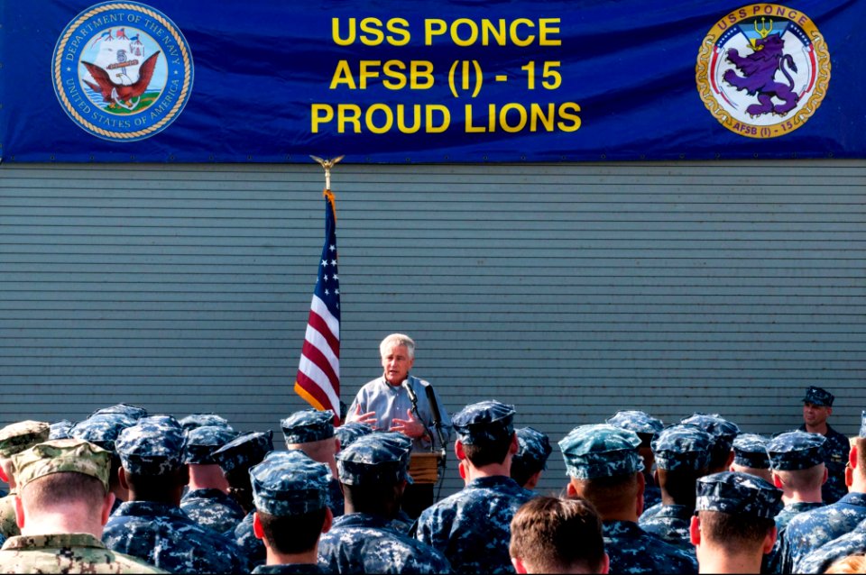 Secretary of Defense Chuck Hagel, at lectern, speaks to troops and merchant mariners aboard the afloat forward staging base USS Ponce (AFSB(I) 15) in Bahrain Dec. 6, 2013 131206-N-IZ292-140
