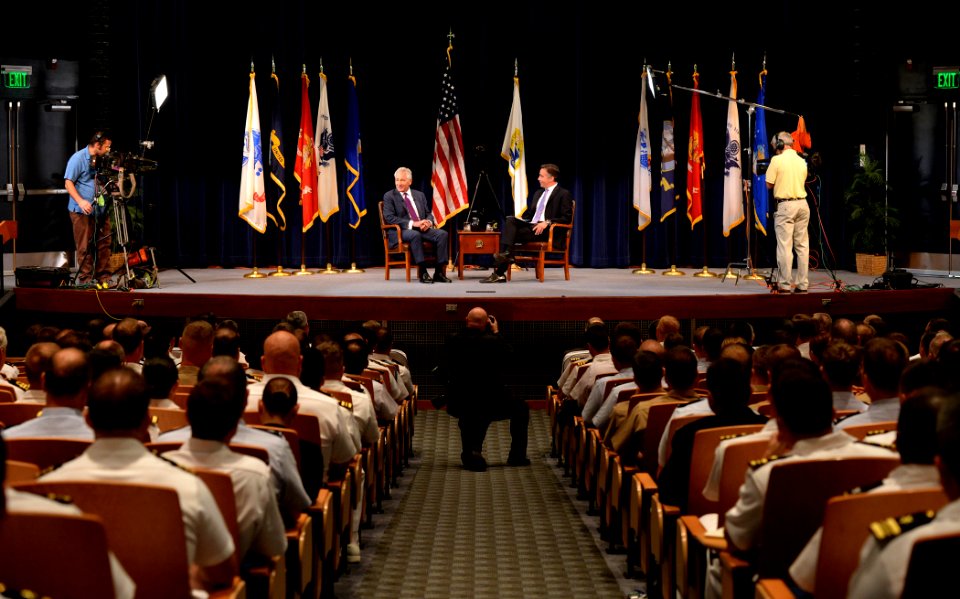 Secretary of Defense Chuck Hagel, center left, discusses current defense issues during a live interview with Jim Sciutto, the chief national security correspondent for CNN, at the U.S. Naval War College 140903-N-PX557-027