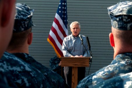 Secretary of Defense Chuck Hagel, at lectern, speaks to troops and merchant mariners aboard the afloat forward staging base USS Ponce (AFSB(I) 15) in Bahrain Dec. 6, 2013 131206-N-IZ292-094