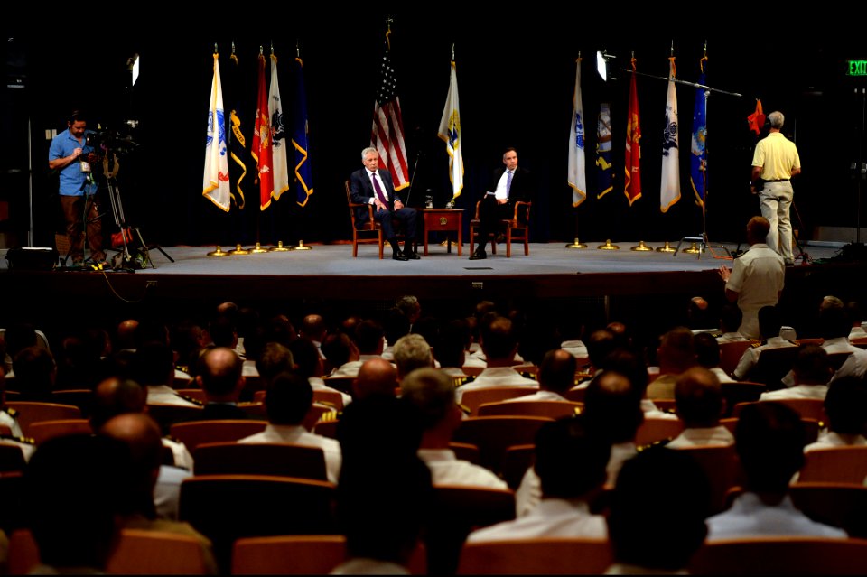 Secretary of Defense Chuck Hagel, center left, takes a question from a U.S. Naval War College student following a live interview about defense issues with Jim Sciutto, center right, the chief national security 140903-N-PX557-131