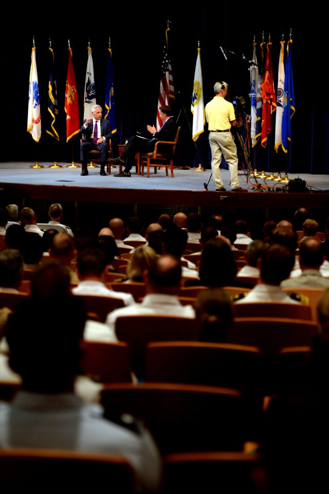 Secretary of Defense Chuck Hagel, on stage, left, discusses current defense issues during a live interview with Jim Sciutto, the chief national security correspondent for CNN, at the U.S. Naval War College 140903-N-PX557-100