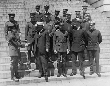 Secretary of the Navy Josephus Daniels shaking hands with Lieutenant Commander A.C. Read of the NC-4 photo