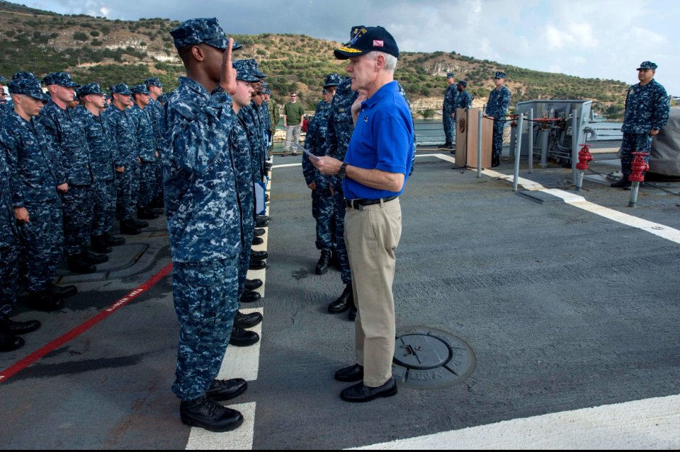 Secretary of the Navy Ray Mabus administers the oath of enlistment to U.S. Navy Quartermaster 3rd Class Nicholas Easter during a re-enlistment ceremony aboard the guided missile destroyer USS Ramage (DDG 61) 131115-N-VC236-043