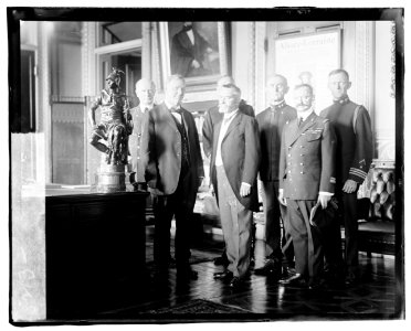 Secretary of the Navy, Josephus Daniels being presented a bronze statue by French Ambassador Jean Jusserand, for the U.S.S. Seattle, which escorted troop-ships to France. Front row, L. to LCCN2016827135