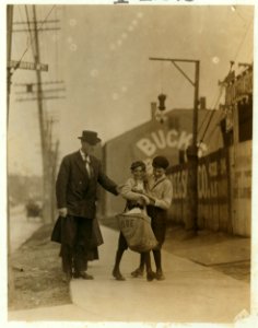 The boy with bags nicknamed Turk said he was going to Texas soon. The investigator found him recently with $1.75 he had just won at craps. N. Broadway and De Soto Sts.,. LOC nclc.03518