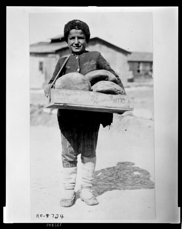 The bread boy - at the camp at Salonica for Greeks who have been brought back from the Caucasus for the purpose of colonizing their country's rewon province of Thrace They have been delayed LCCN2010648497