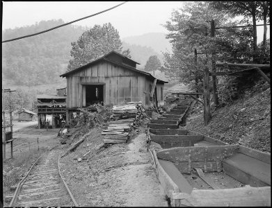 The cars, repair shop and tipple below. P V & Coal Company, Clover Gap Mine, Lejunior, Harlan County, Kentucky. - NARA - 541299