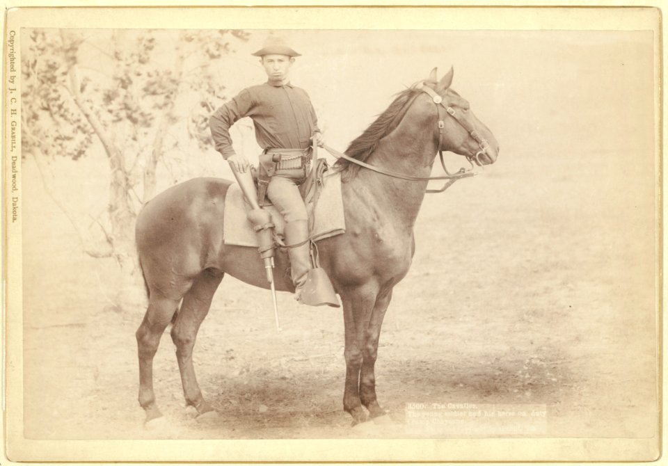 The Cavalier. The young soldier and his horse on duty (a)t camp Cheyenne - photo and copyright by Grabill. LCCN99613834