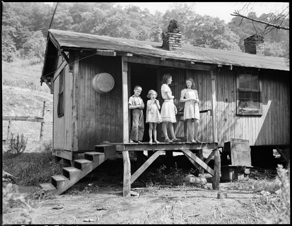 The children of Gillie Treadway a miner, on the back porch of the four room house of which they pay $5.25 monthly... - NARA - 541158