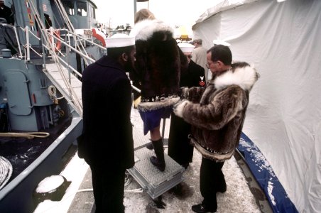 Senator Ted Stevens and his wife, Catherine, board a tug after the commissioning of the nuclear-powered strategic missile submarine USS ALASKA