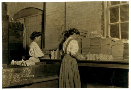 Seneca Glass Works, Morgantown, W. Va. Girls wrapping and packing. Girl in centre said she was 13. this is a co-operative institution run in the interests of the workers as well as LOC cph.3a13358