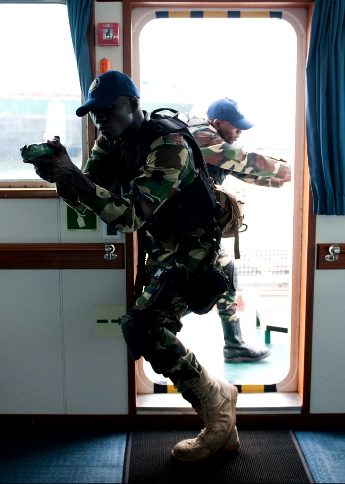 Senegalese service members practice room clearing and tactical movement techniques aboard the Spanish Civil Guard patrol ship Rio Segura March 8, 2014, in Dakar, Senegal, during exercise Saharan Express 2014 140308-N-QY759-086
