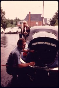 Service Station Mechanic Adjusts the Engine for a Young Woman Whose Vehicle Had Failed the Emissions Test at an Auto Emission Inspection Station in Downtown Cincinnati, Ohio...09-1975 (4266545298)