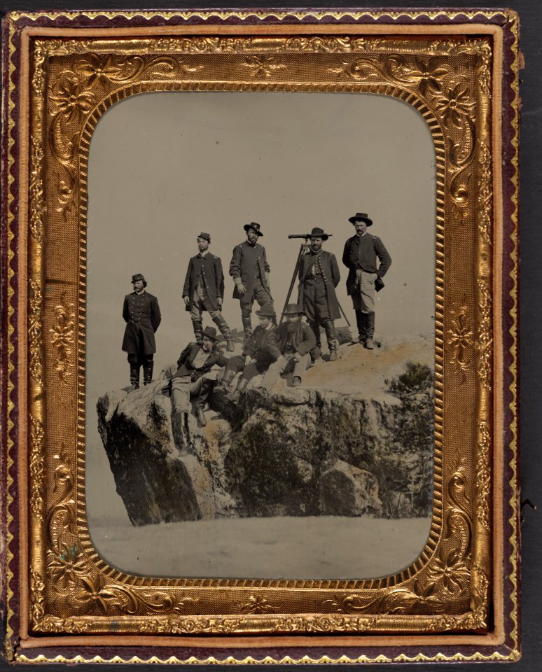Seven unidentified officers and soldiers in Union uniforms and one officer identified as Major Charles S. Cotter of 1st Ohio Light Artillery Regiment, with telescope, at Point Lookout, LCCN2012647006