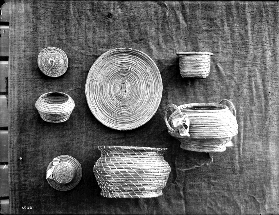 Seven unidentified Indian baskets on display, ca.1900 (CHS-3948)