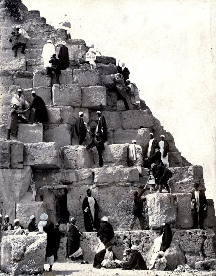 Several people gathered at the base of the Great Pyramid