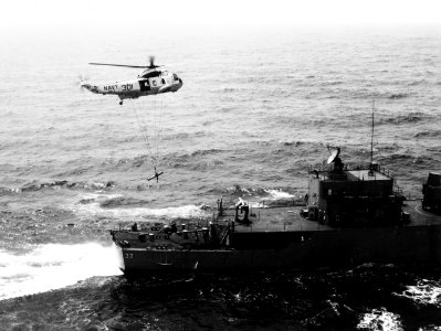 SH-3A of HS-2 lowers torpedo on USS Parsons (DDG-33) in April 1969