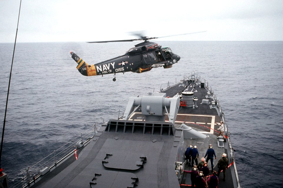 SH-2F of HSL-31 over USS Jouett (CG-29) in 1989